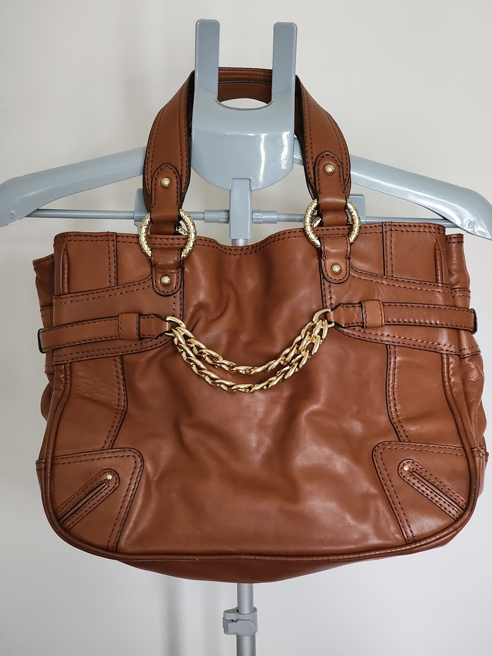 Antonio Melani leather satchel featuring gold-tone chain accents